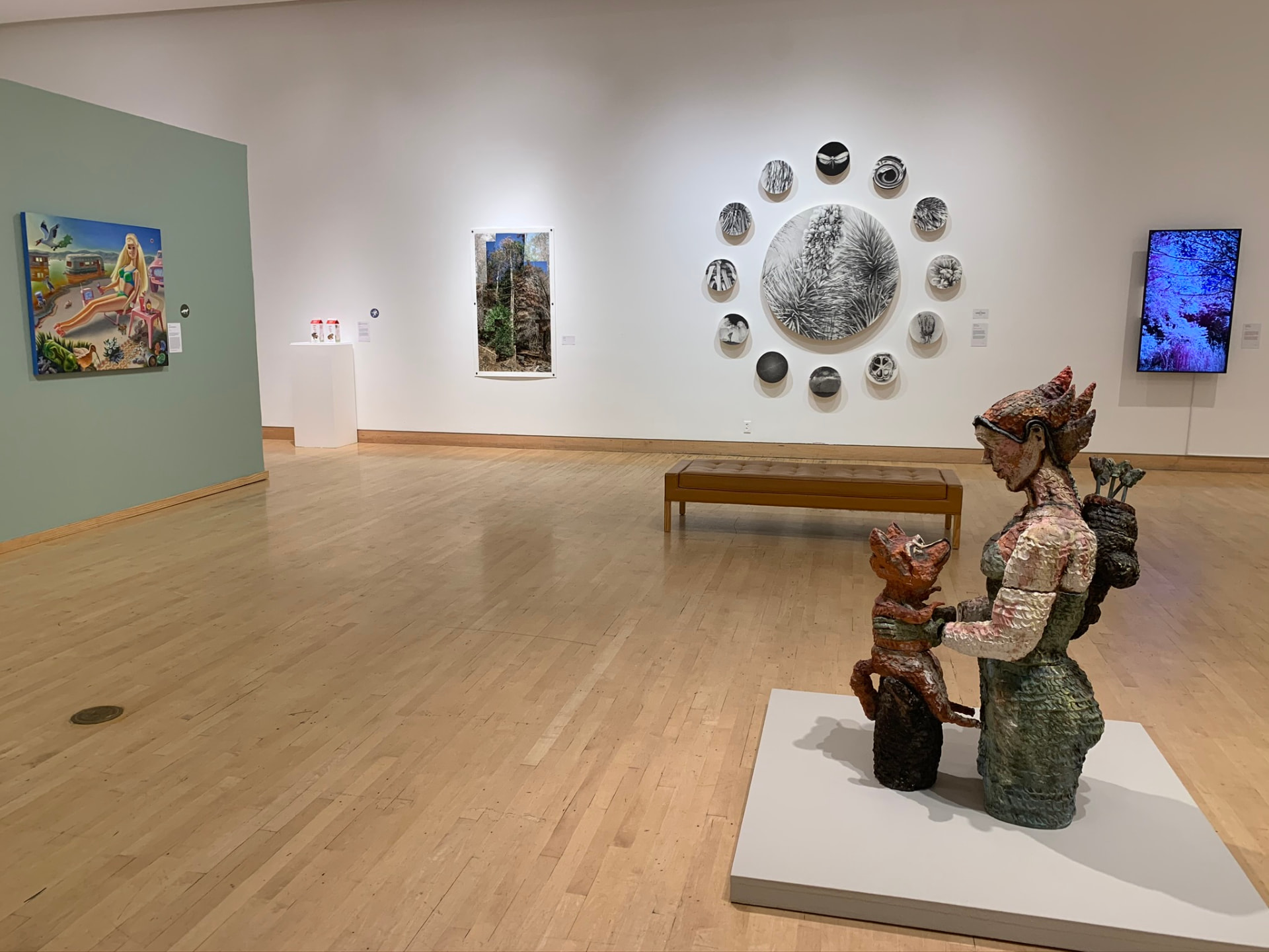 Installation view of Endangered: Exploring California's Changing Ecosystem, with paintings, ceramics and works on paper